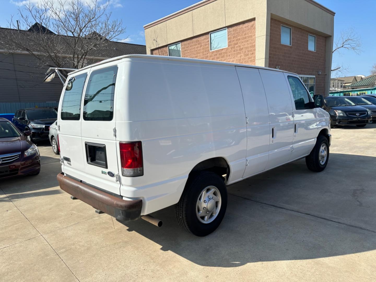 2011 White /Gray Ford E-Series Van (1FTNE2EWXBD) with an 4.6L engine, Automatic transmission, located at 1501 West 15th St., Houston, 77008, (713) 869-2925, 29.797941, -95.411789 - Photo#2